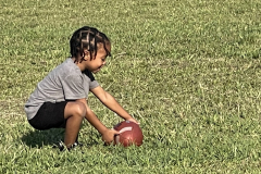 kid-playing-with-football